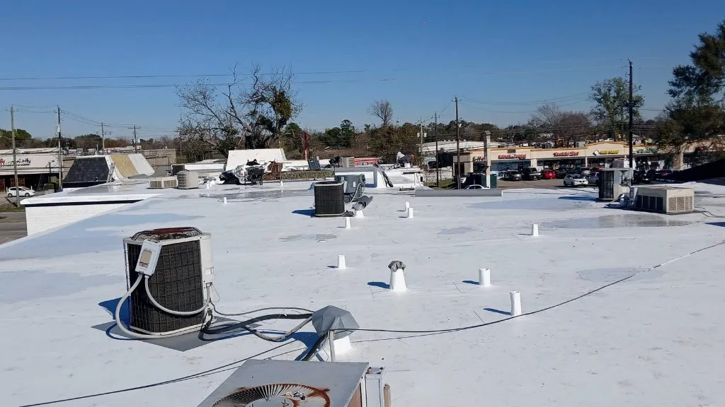 Completed commercial flat roof with rooftop equipment