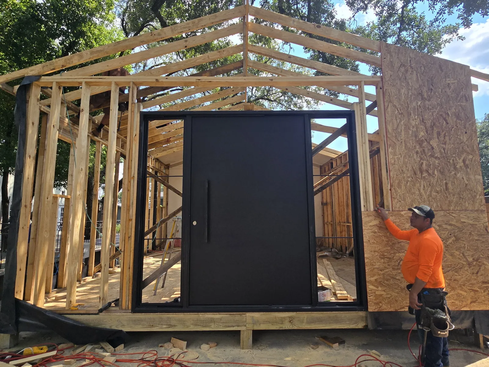 Wood framed structure under construction by Momiko