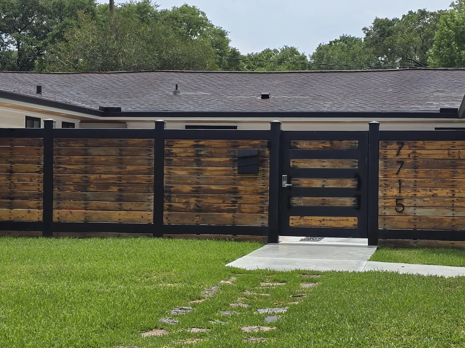 Custom wood and steel entry gate installed by Momiko